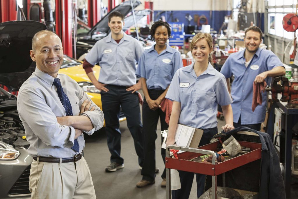 portrait of smiling auto repair shop team with pac 2026 01 09 08 36 18 utc